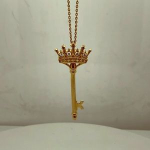 14k yellow gold crown key pendant.